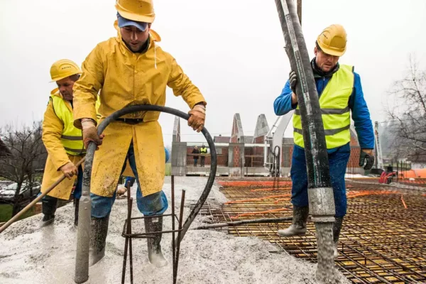 construction-workers-pouring-cement-on-roof